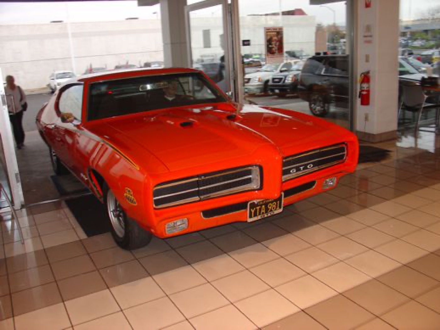 Iconic orange GTO Judge, showroom hero shot