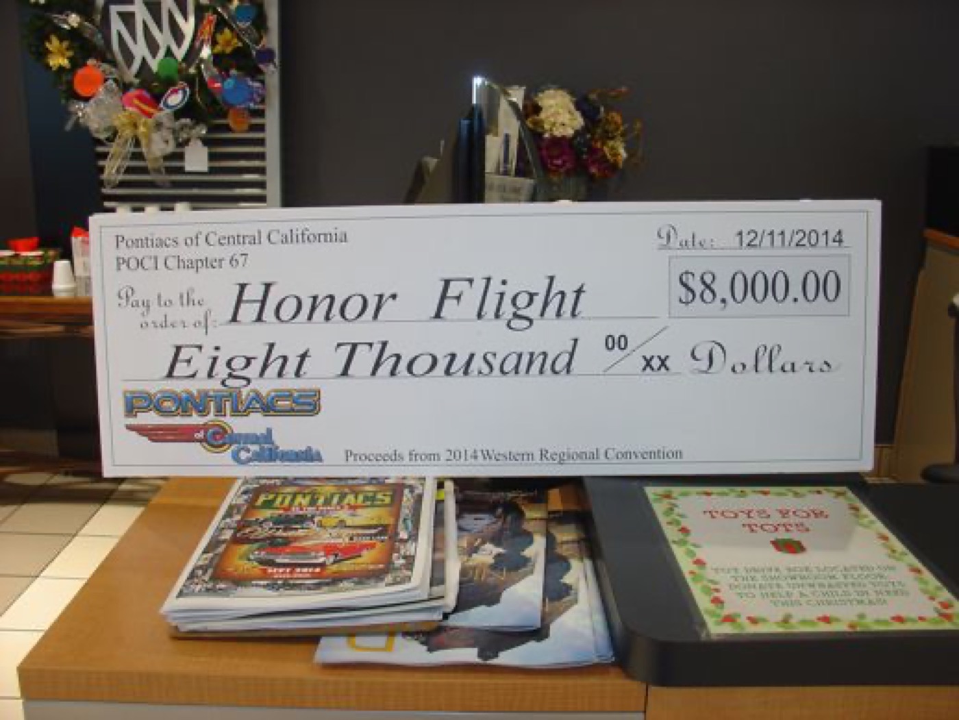 Honor Flight charity check, club giving back
