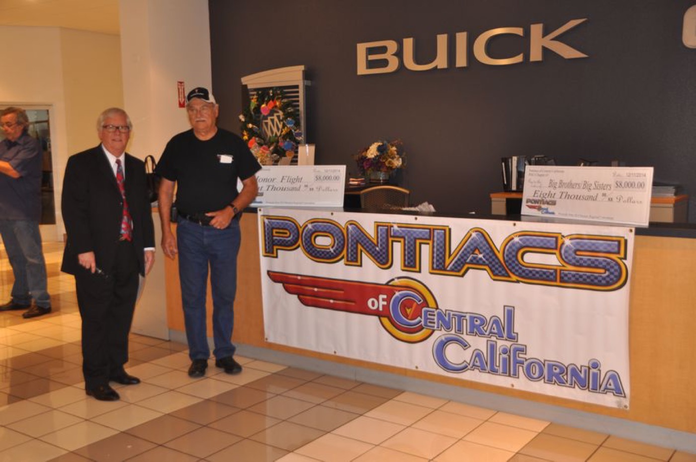 Proud members at the Pontiacs club banner