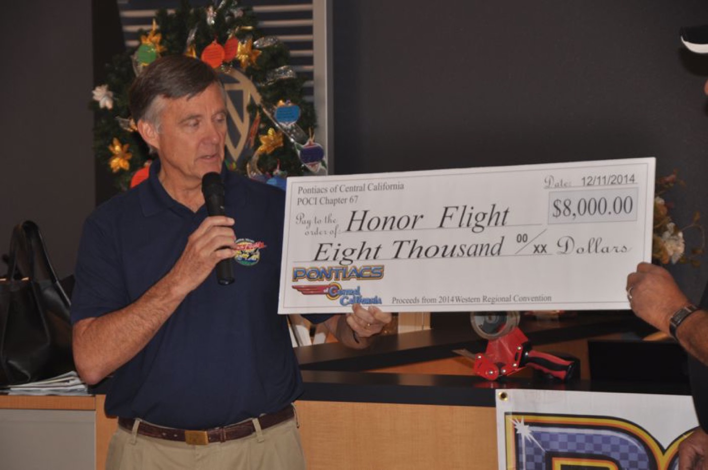 Eight thousand dollar Honor Flight check presented proudly