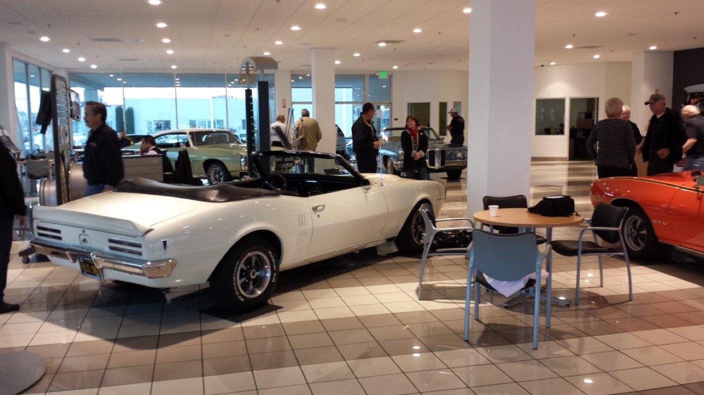 Crisp white Pontiac convertible at indoor show