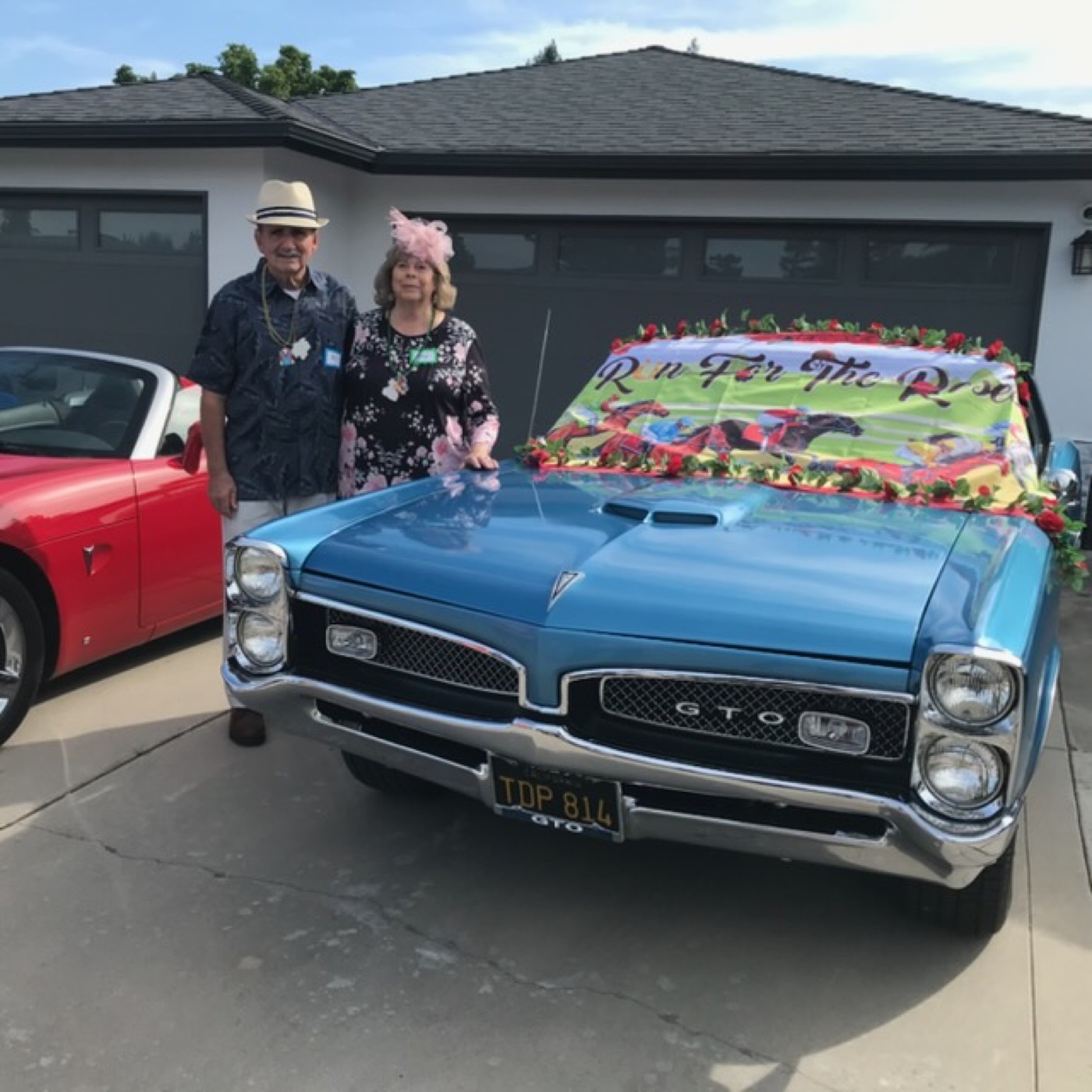 Blue GTO convertible decked for Derby day